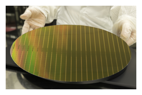man holding silicon wafer