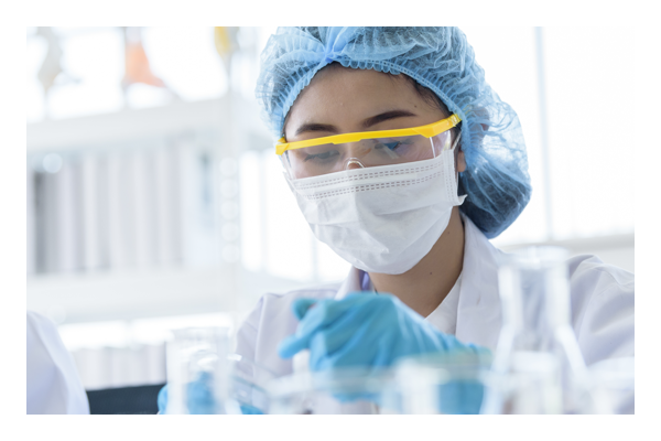 Women working in lab wearing safety equipment 