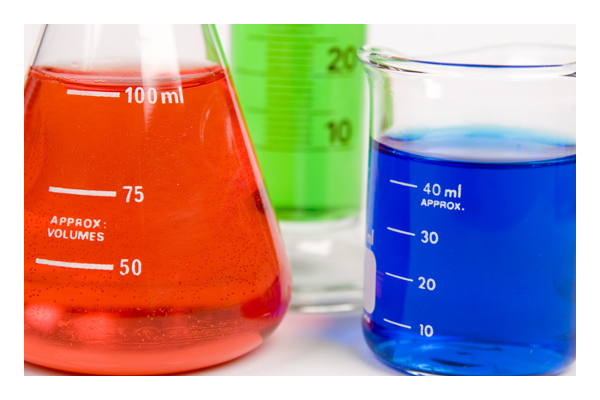 Three beakers filled with Red, Green, and Blue liquids